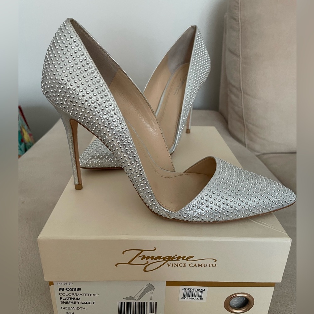 Elegant silver high heels , size 8 . Used once